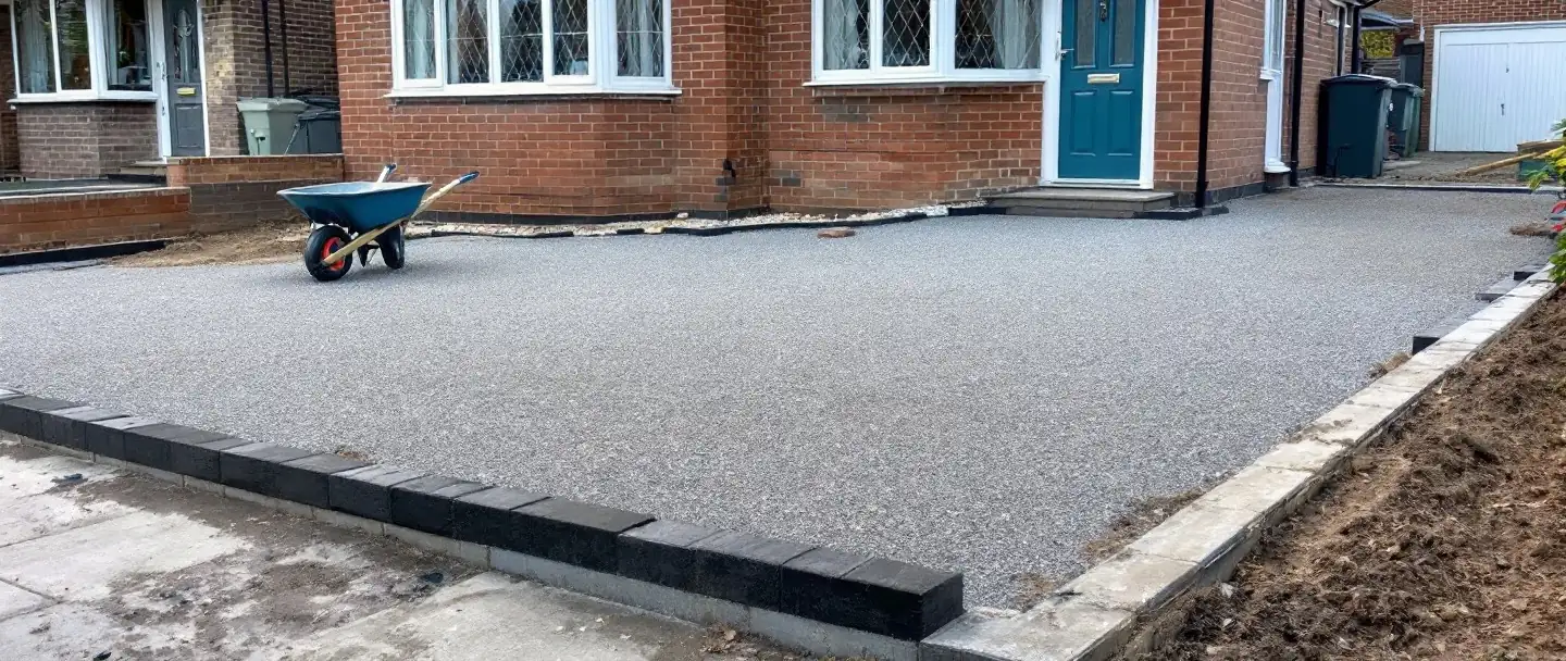 Compacted sub-base and new edging ready for a resin bound driveway